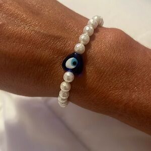 Handmade mother of pearl evil eye bracelet